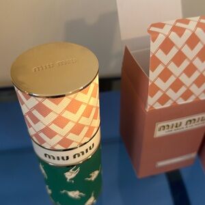 Miu Miu Fragrance with Gold and Green Accents